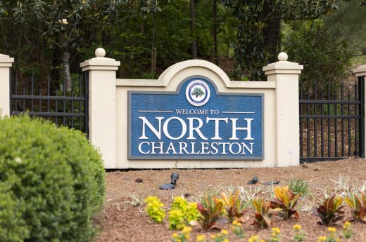 North Charleston, South Carolina city limits welcome sign with trees and flowers off of interstate I-26 in South Carolina